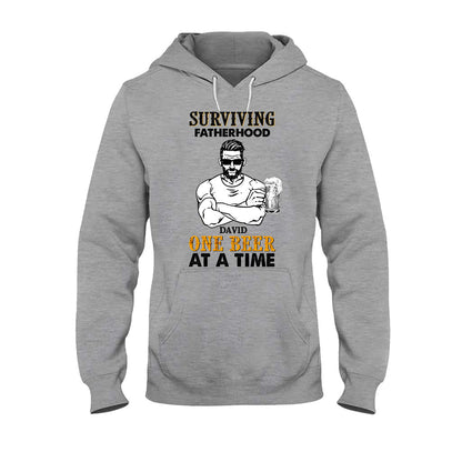 Surviving Fatherhood One Beer At A Time - Personalized Father's Day T-shirt and Hoodie